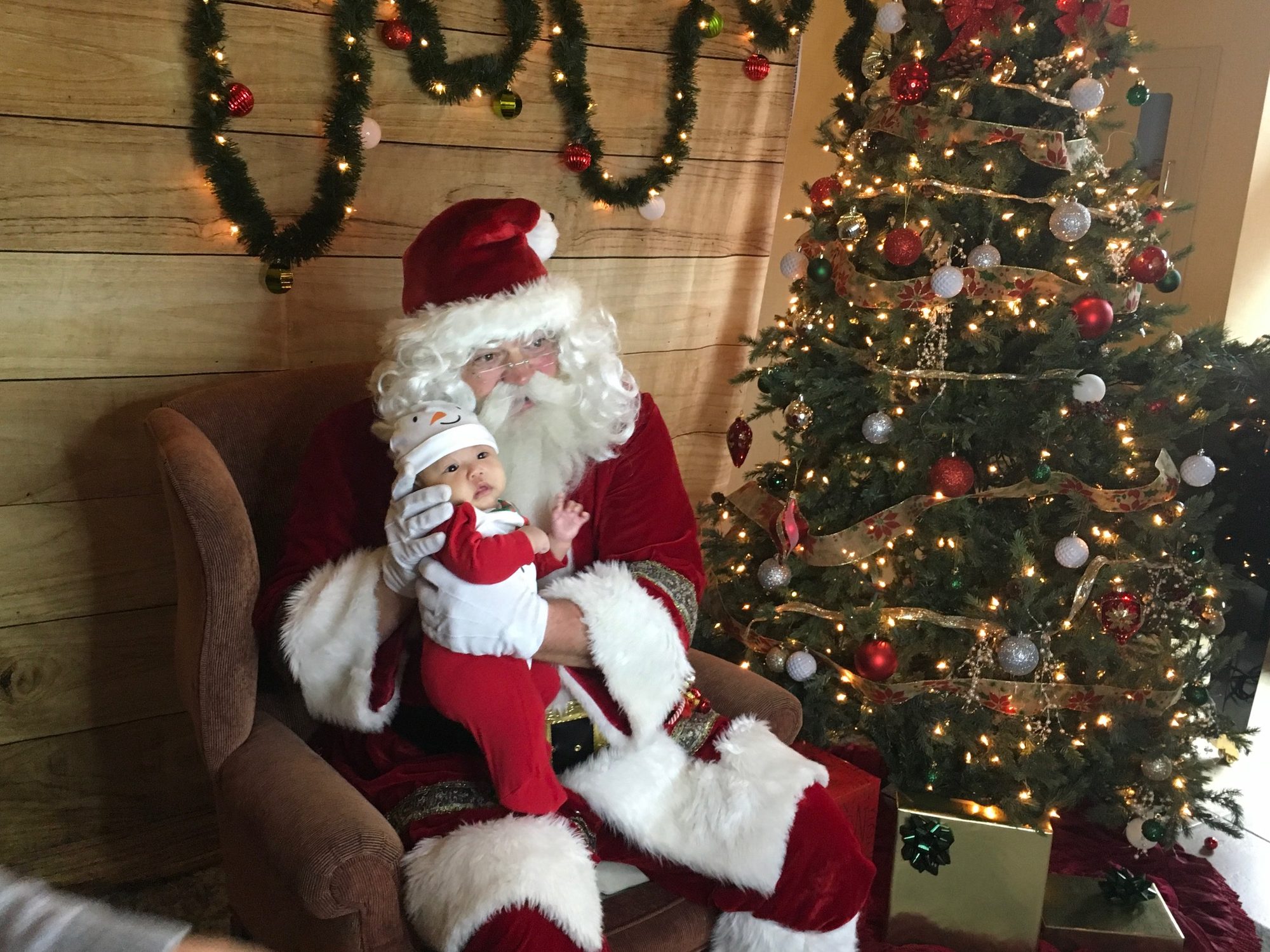 Santa Claus greeting a family